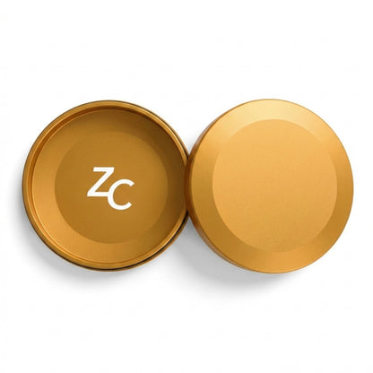 Z Caddy metal pouch can in gold, lid and base shown separated from above