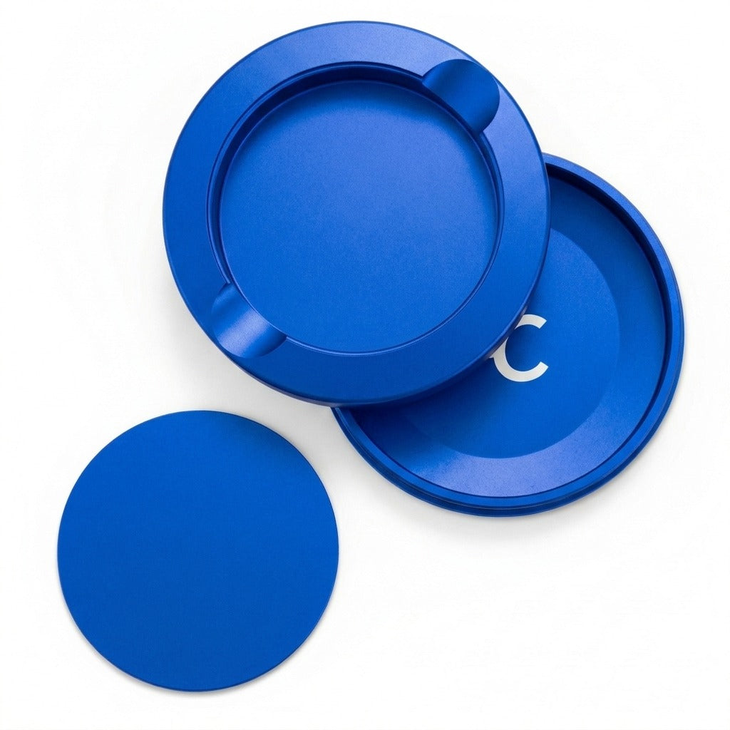 Z Caddy metal pouch can in blue, lid, disposal chamber and base shown separated from above