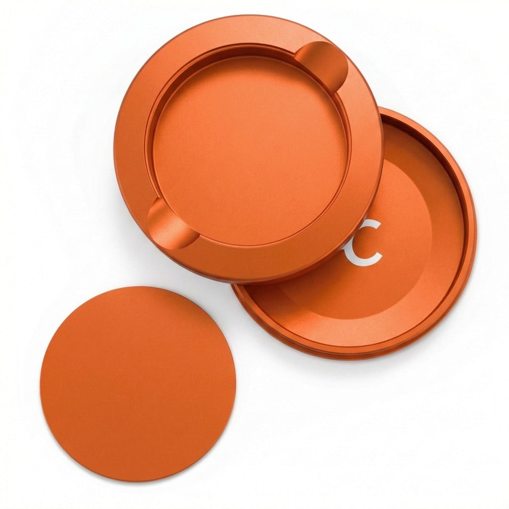 Z Caddy metal pouch can in orange, lid, disposal chamber and base shown separated from above