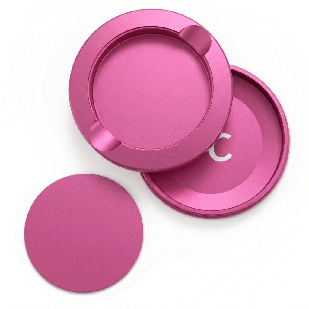 Z Caddy metal pouch can in pink, lid, disposal chamber and base shown separated from above